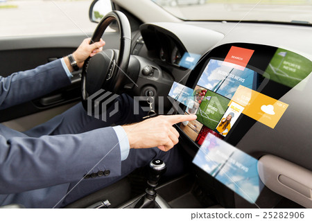 man driving car with news on board computer 25282906