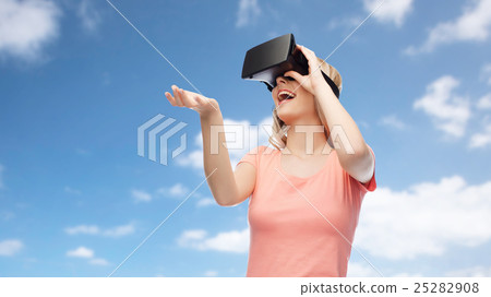 woman in virtual reality headset or 3d glasses 25282908