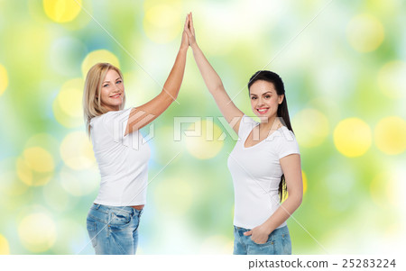 group of happy different women in white t-shirts 25283224