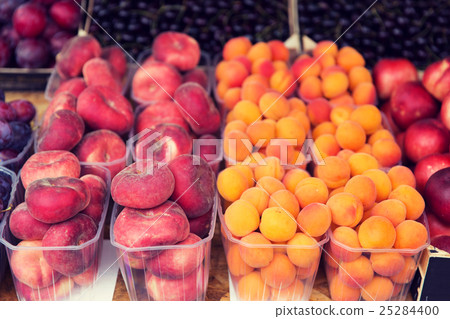 close up of peaches and apricots at street market close up of peaches and apricots at street market 25284400