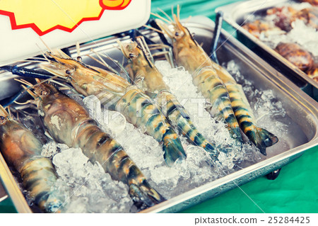 shrimps or seafood on ice at asian street market shrimps or seafood on ice at asian street market 25284425