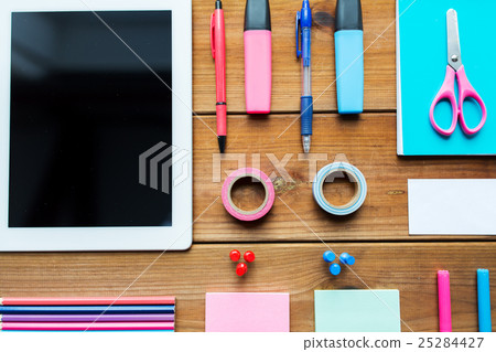 close up of school supplies and tablet pc close up of school supplies and tablet pc 25284427
