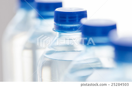 close up of plastic bottles with drinking water 25284503