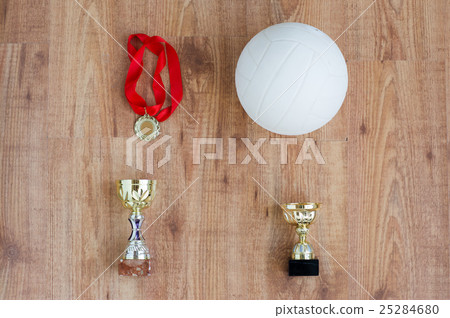 close up of volleyball ball, cups and medals close up of volleyball ball, cups and medals 25284680