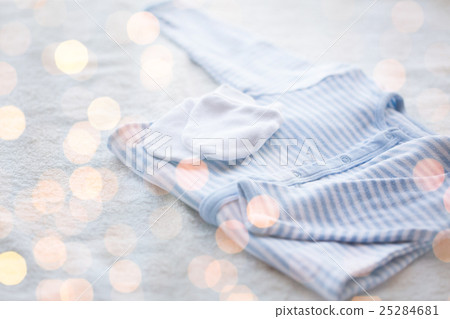 close up of baby boys clothes for newborn on table close up of baby boys clothes for newborn on table 25284681