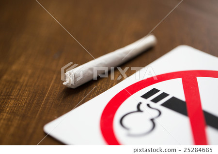 close up of marijuana joint or handmade cigarette close up of marijuana joint or handmade cigarette 25284685