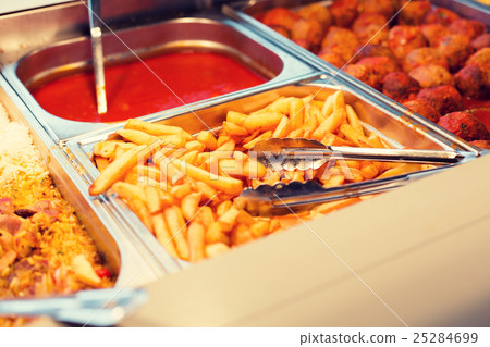 close up french fries of and other dishes on tray 25284699