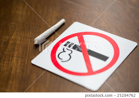 close up of marijuana joint or handmade cigarette close up of marijuana joint or handmade cigarette 25284762
