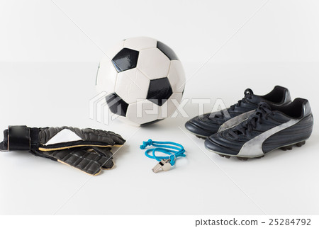 close up of soccer ball, gloves, whistle and boots 25284792