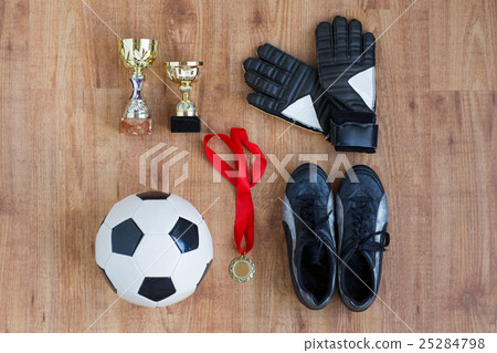 ball, football boots, gloves, cups and medal 25284798