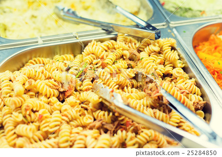 close up of pasta and dishes on catering tray 25284850