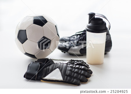 close up of football boots, gloves and bottle close up of football boots, gloves and bottle 25284925