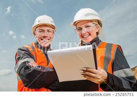 Two people working Two people working 25285751