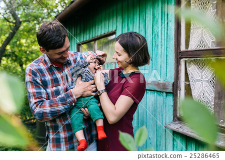young family with a child on the nature 25286465