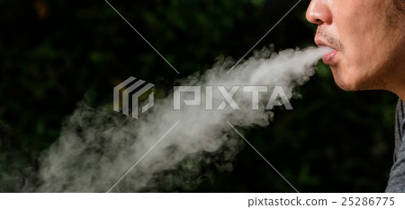 Side view of young man is smoking 25286775