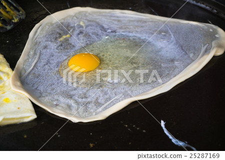 cooking Southern flat bread /egg on pan cooking Southern flat bread /egg on pan 25287169