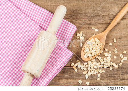 oats in spoon on wood table oats in spoon on wood table 25287374