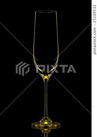 Silhouette of yellow champagne glass on black Silhouette of yellow champagne glass on black 25289532