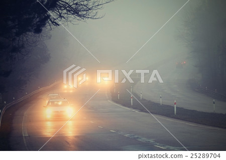 Cars in the fog. Bad winter weather and danger. 25289704
