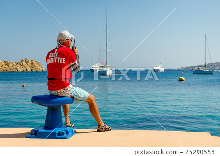 Sailing race referee watching at the yachts in Sailing race referee watching at the yachts in 25290553