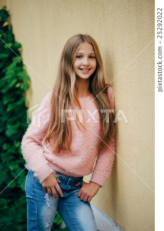 beautiful young girl posing on the street 25292022