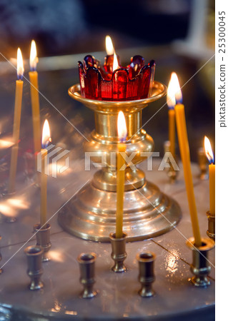 burning Church candles burning Church candles 25300045