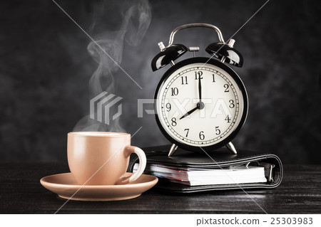 Alarm clock and a cup of coffee 25303983