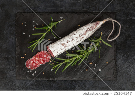 Salami on dark background 25304147