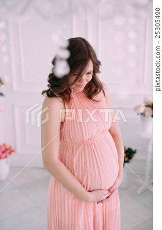 Happy pregnant young woman waiting for a child Happy pregnant young woman waiting for a child 25305490