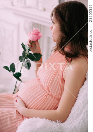 Happy pregnant young woman waiting for a child Happy pregnant young woman waiting for a child 25305535