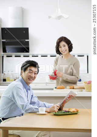 Happy Middleaged Asian Couple at Home 25307155