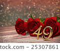 birthday concept with red roses on wooden desk 25307861