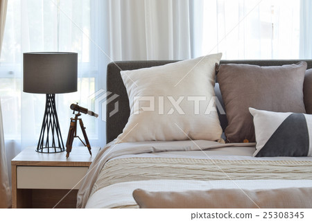 stylish bedroom with brown patterned pillow on bed stylish bedroom with brown patterned pillow on bed 25308345