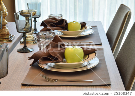 elegant table set in modern style dining room 25308347