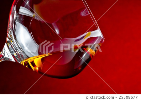 snifter of brandy in elegant glass with space for text 25309677