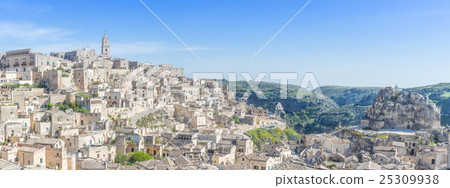 panoramic view of typical stones (Sassi di Matera) and church of Matera UNESCO European Capital of Culture 2019 under blue sky panoramic view of typical stones (Sassi di Matera) and church of Matera UNESCO European Capital of Culture 2019 under blue sky 25309938