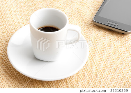 cup of coffee with smartphone cup of coffee with smartphone 25310269