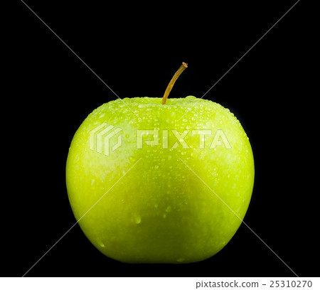 fresh green apple with droplets of water against black background 25310270