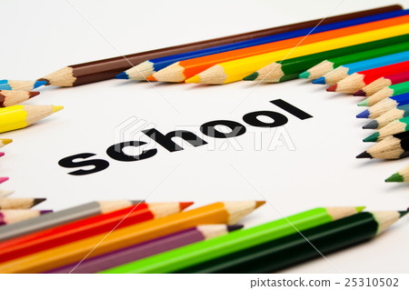 many colored pencils arranged around the word school 25310502