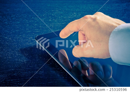 businessman touching digital tablet pc in the office businessman touching digital tablet pc in the office 25310596
