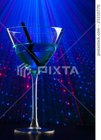 blue cocktail drink in a disco with space for text blue cocktail drink in a disco with space for text 25310776