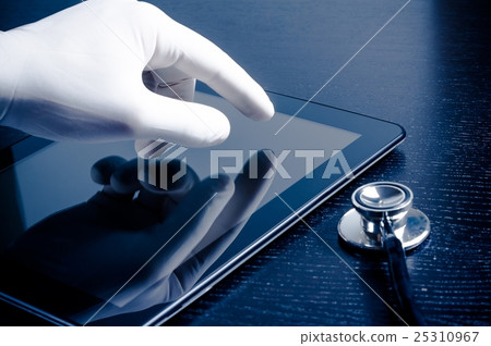hand in medical glove touching modern digital tablet pc near stethoscope 25310967