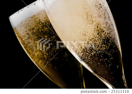 two flutes with champagne gold bubbles two flutes with champagne gold bubbles 25311319