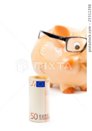 fifty euro banknote in front of unfocused piggy bank with glasses, concept for business and save money 25311398