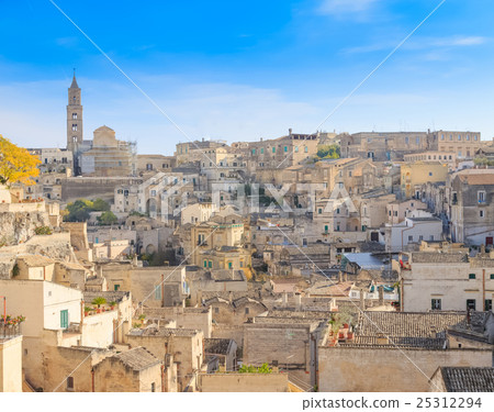 panoramic view of typical stones (Sassi di Matera) and church of Matera under blue sky panoramic view of typical stones (Sassi di Matera) and church of Matera under blue sky 25312294