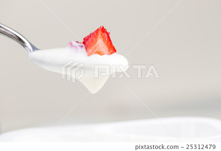 healthy strawberry and white yogurt on the spoon 25312479