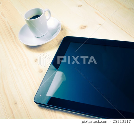 cup of coffee near a tablet, concept of new technology cup of coffee near a tablet, concept of new technology 25313117