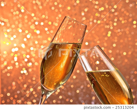 pair of a champagne flutes with gold bubbles on light bokeh background pair of a champagne flutes with gold bubbles on light bokeh background 25313204