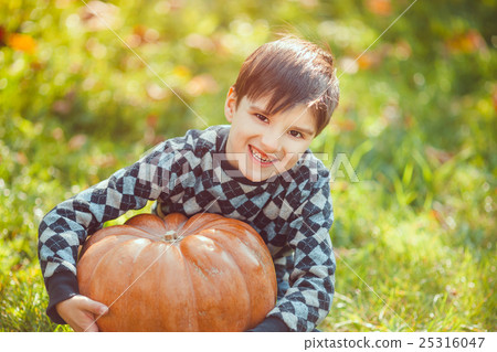 Boy Playing With Pumpkin Boy Playing With Pumpkin 25316047