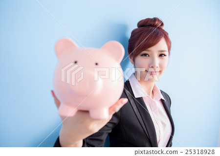woman take pink piggy bank 25318928